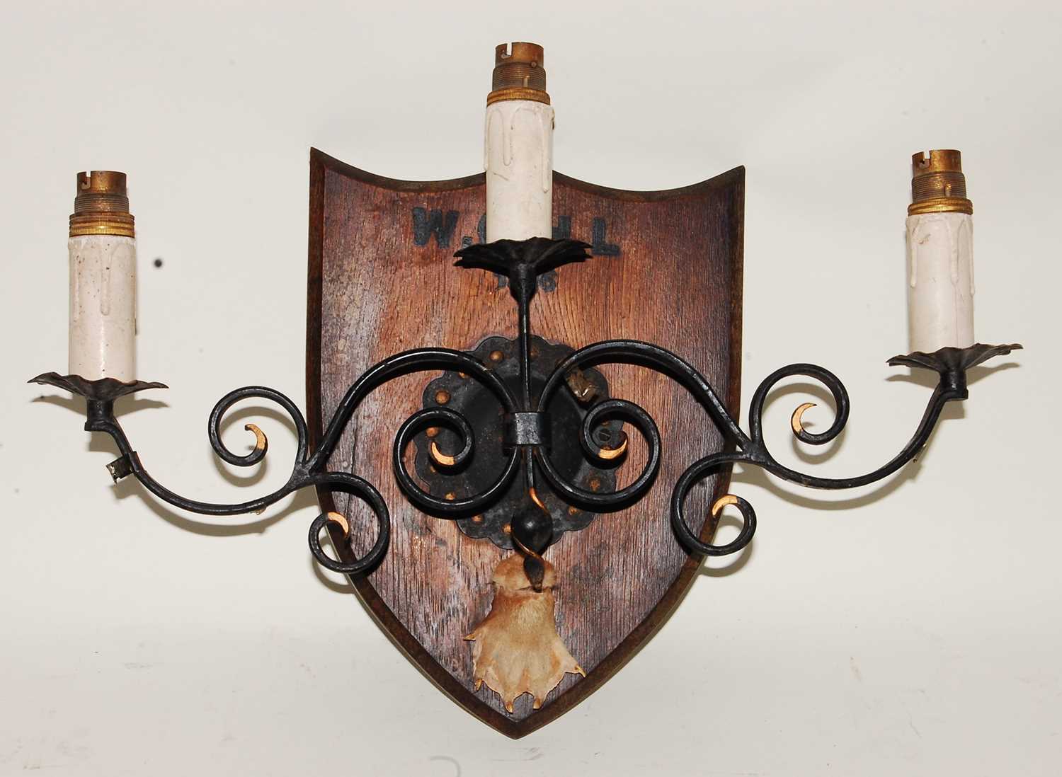 Lot 668 - * A mid-20th century wrought iron three sconce...