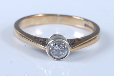 Lot 2654 - A 9ct yellow and white gold diamond solitaire...