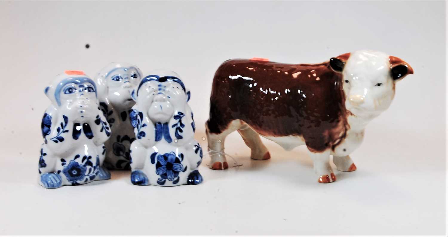 Lot 15 - A large ceramic model of a bull, width 26cm,...