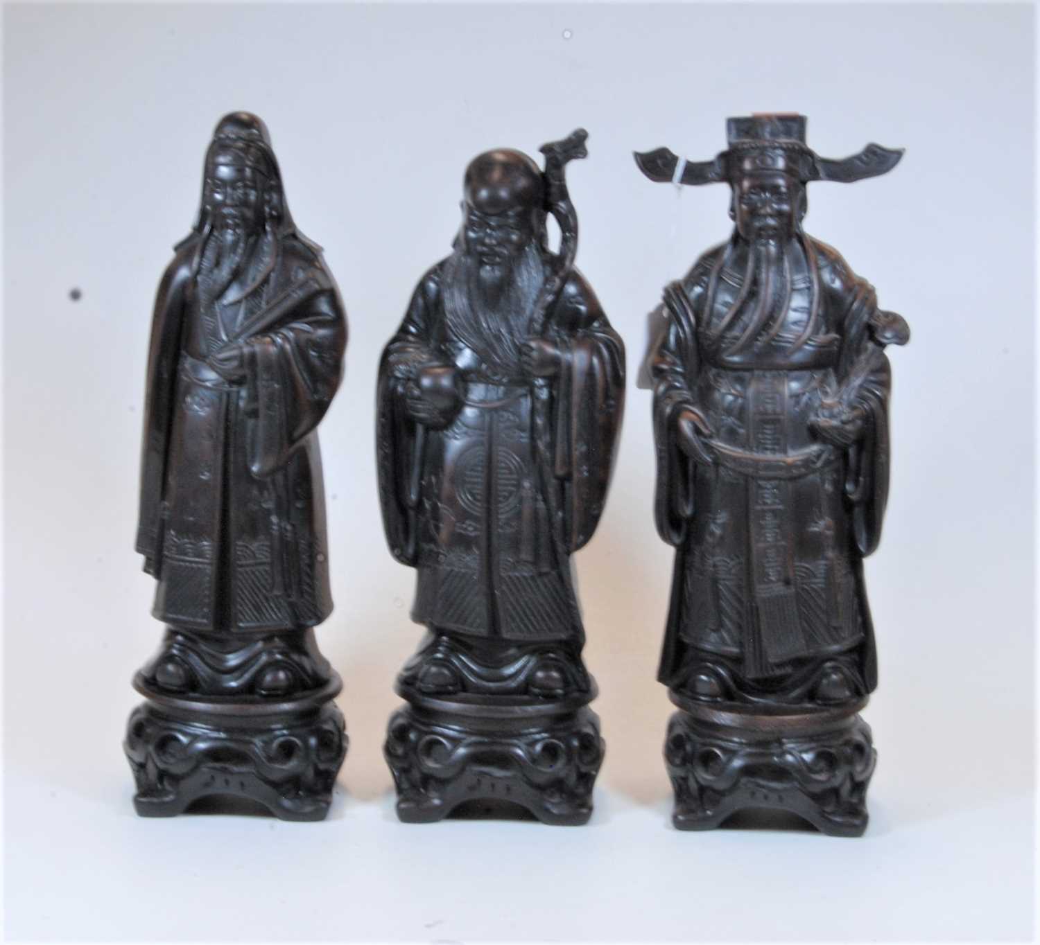 Lot 17 - A set of three modern resin figures of the...
