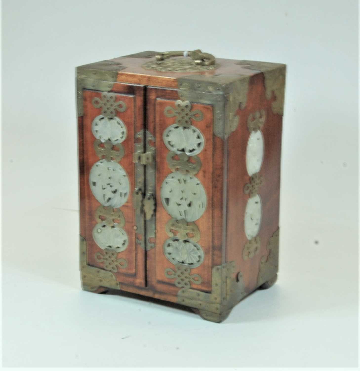 Lot 28 - A Chinese hardwood and brass bound double door...