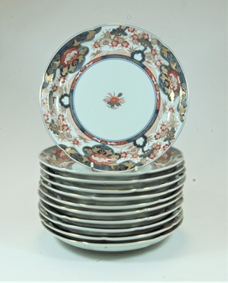 Lot 33 - A set of 12 Japanese plates of shaped circular...
