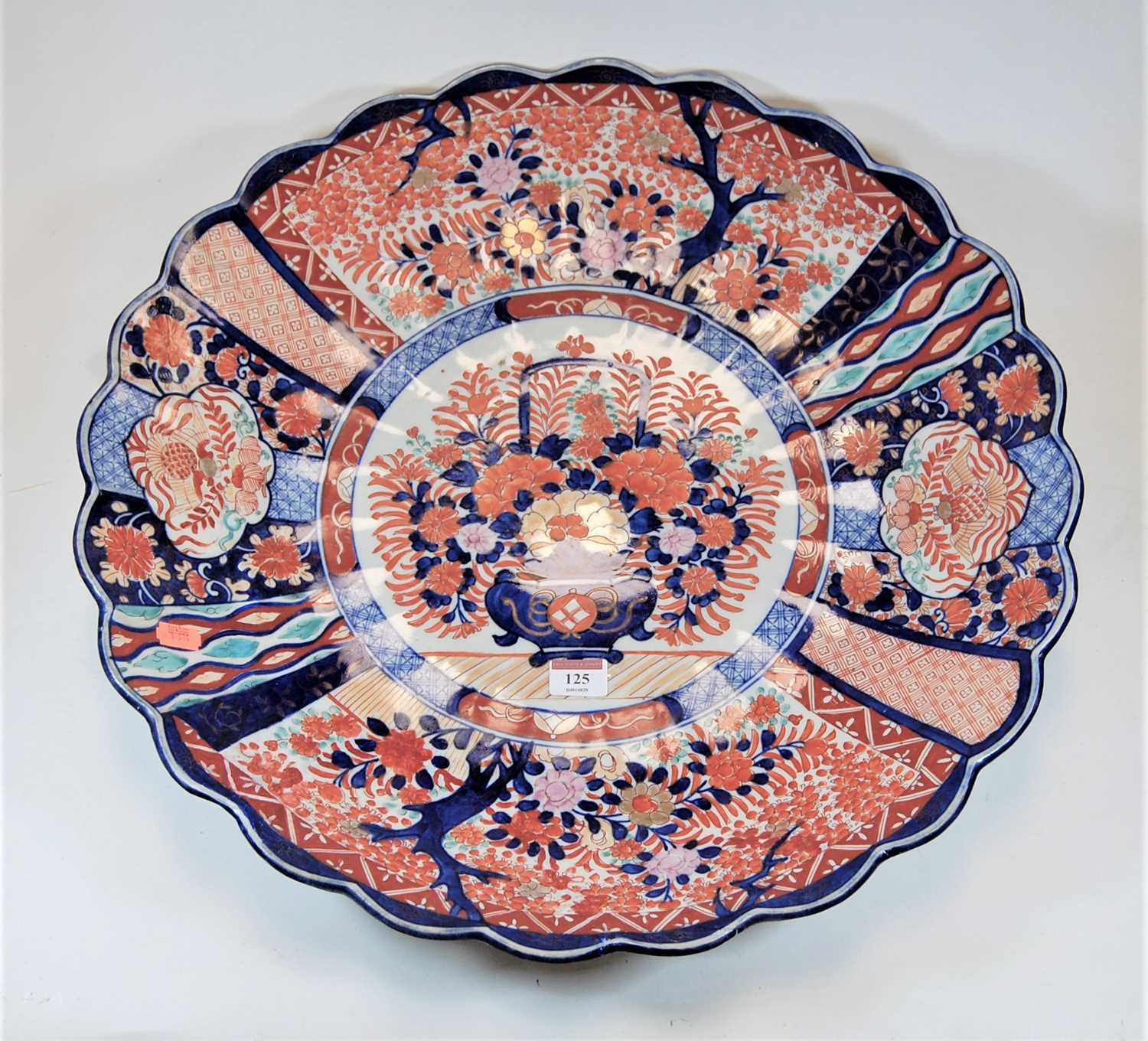 Lot 125 - A large Japanese Imari charger of scalloped...