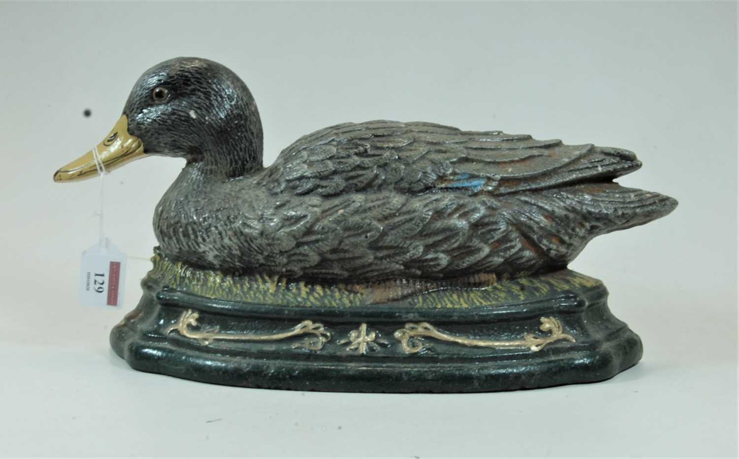 Lot 129 - A modern cast iron door stop in the form of a...