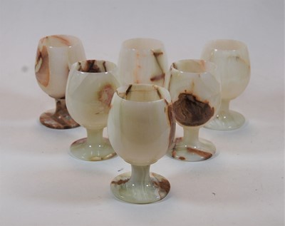 Lot 194 - A set of six circa 1970s onyx goblets, each...