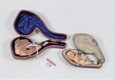 Lot 278 - A Victorian pipe, the bowl carved as a lady's...