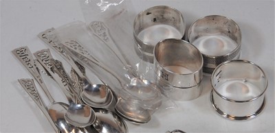 Lot 308 - A set of nine silver teaspoons, each having a...