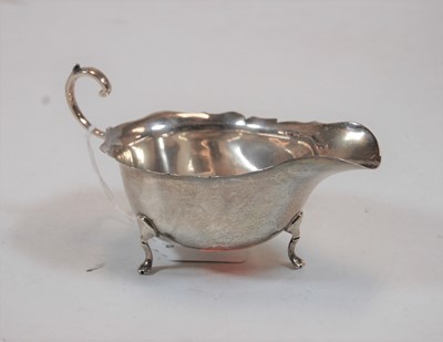 Lot 245 - A George V silver sauceboat in the 18th...