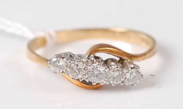 Lot 334 - An 18ct gold diamond five stone ring, the five...