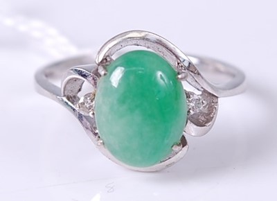Lot 357 - A 14ct white gold cabochon jade and twin...