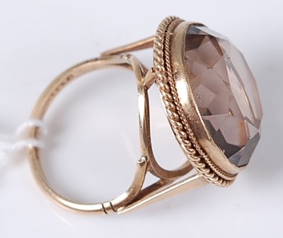 Lot 360 - A modern 9ct gold smoky quartz set dress ring,...