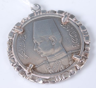 Lot 369 - An Iznik white metal coin in pendant mount, 19....