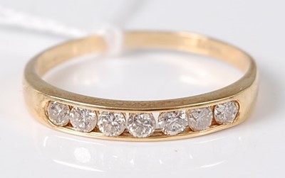Lot 370 - An 18ct gold diamond half eternity ring, the...