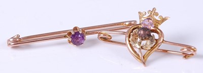 Lot 374 - A 9ct gold and amethyst set safety pin brooch,...