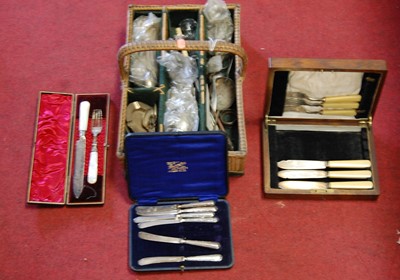 Lot 68 - Assorted cased and loose flatware, in a wicker...