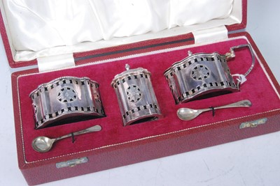 Lot 1145 - A cased silver three-piece cruet set,...