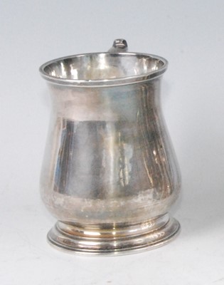Lot 1165 - A George II silver bell-shaped tankard, having...
