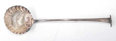 Lot 1148 - An early George III silver soup ladle, having...