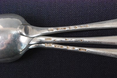 Lot 1153 - A set of six George III silver dessert spoons,...