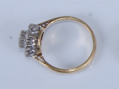 Lot 1204 - An 18ct yellow and white gold diamond circular...