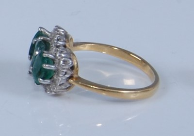 Lot 1207 - An 18ct yellow and white gold, emerald and...