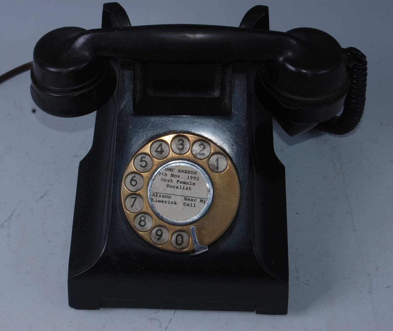 Lot 516 - A bakelite telephone, the centre of the dial...