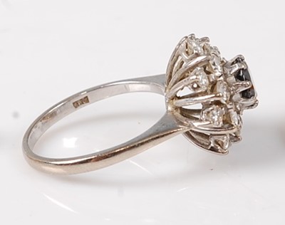 Lot 2728 - An 18ct white gold, sapphire and diamond...