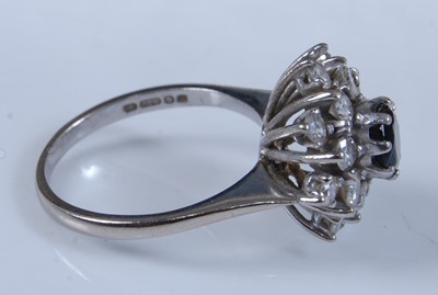 Lot 2728 - An 18ct white gold, sapphire and diamond...