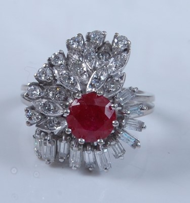 Lot 1253 - A white metal, ruby and diamond cocktail...