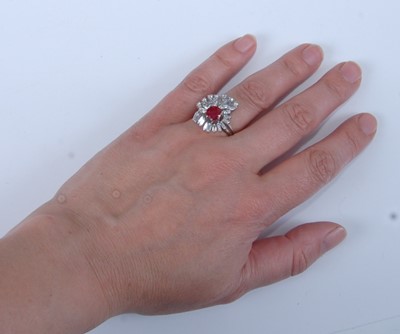 Lot 1253 - A white metal, ruby and diamond cocktail ring,...