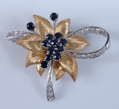 Lot 1255 - An 18ct yellow and white gold, sapphire and...