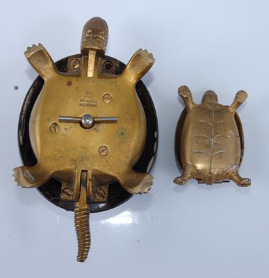 Lot 1287 - An antique mechanical brass hotel desk bell in...
