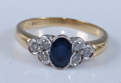 Lot 1240 - An 18ct yellow and white gold, sapphire and...