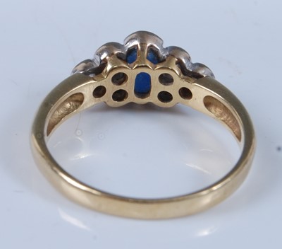 Lot 1240 - An 18ct yellow and white gold, sapphire and...