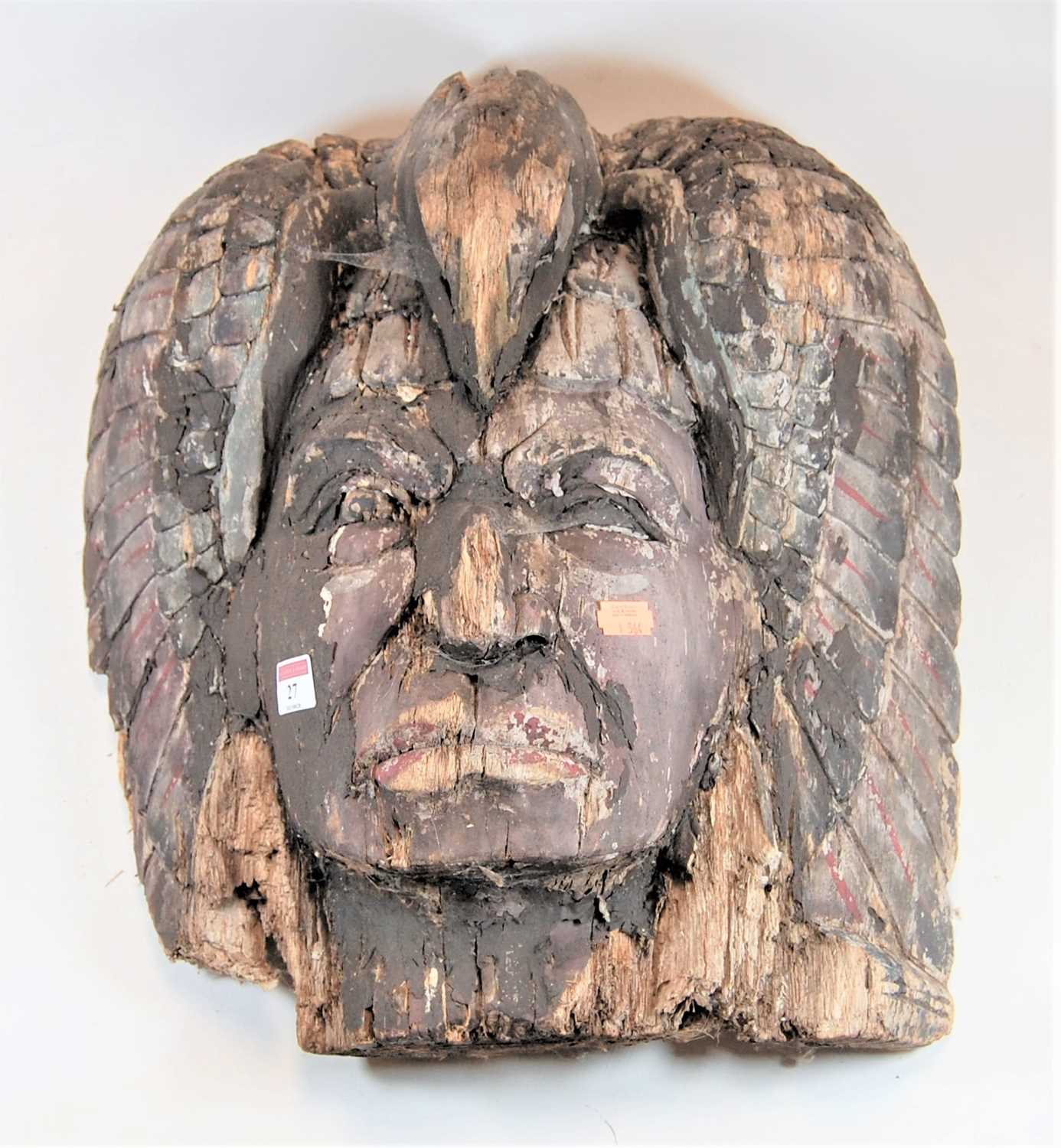 Lot 27 - A Native American carved softwood mask of a...