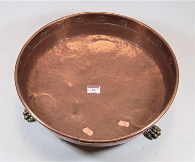 Lot 76 - A hammered copper preserve pan with brass lion...