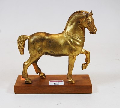 Lot 163 - A gilt metal model of a Tang horse, on...
