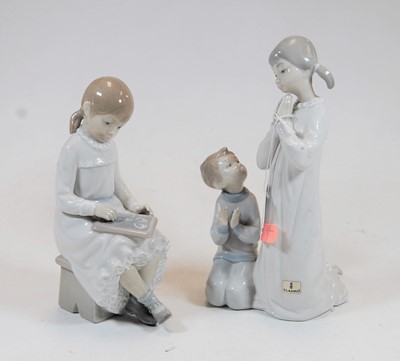 Lot 171 - A Lladro Spanish porcelain figure of two young...