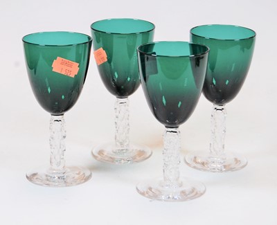 Lot 176 - A set of four green tinted drinking glasses,...