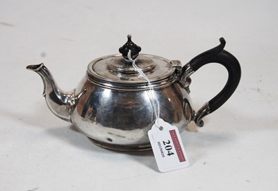 Lot 204 - A 1930s silver bachelors teapot, of squat...