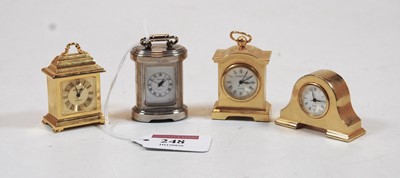 Lot 248 - A miniature barrel shaped carriage timepiece,...