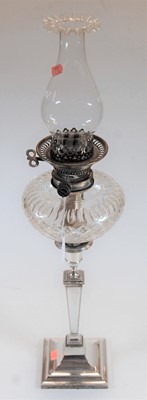 Lot 99 - An early 20th century silver plated oil lamp,...