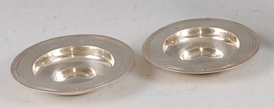 Lot 84 - Two similar 1970s silver miniature alms dishes,...
