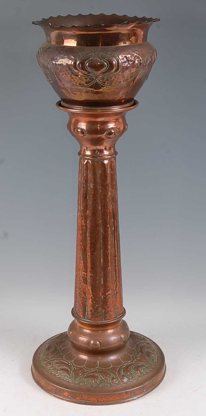 Lot 201 - An Art Nouveau embossed and hammered copper...