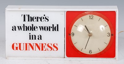 Lot 126 - A Guinness plastic electric advertising clock,...
