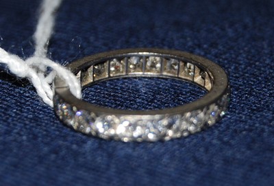 Lot 1272 - A white metal full hoop eternity ring,...