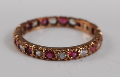 Lot 2644 - A 9ct yellow gold, synthetic ruby and sapphire...