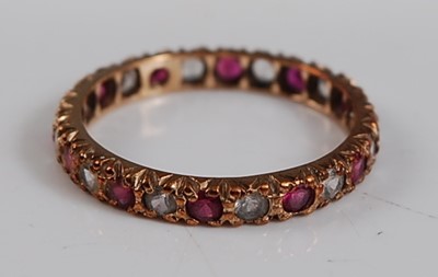 Lot 2644 - A 9ct yellow gold, synthetic ruby and sapphire...