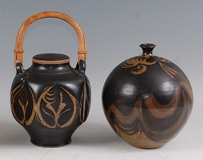 Lot 34 - A studio pottery swing handle jar and cover,...