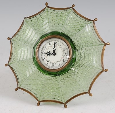 Lot 125 - A novelty green pressed glass and brass...